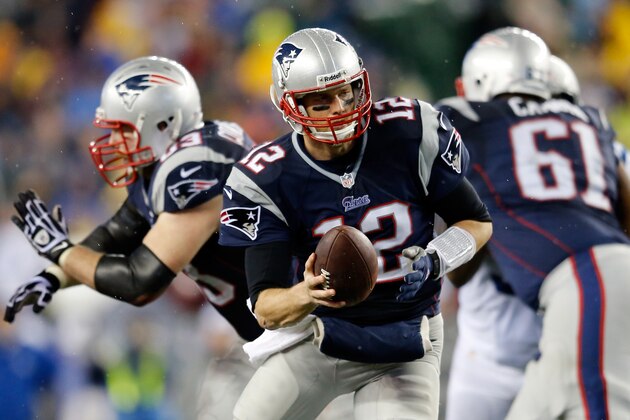 FOXBORO, MA - JANUARY 11:  Tom Brady #12 of the New England Patriots in action against the Indianapolis Colts during the AFC Divisional Playoff game at Gillette Stadium on January 11, 2014 in Foxboro, Massachusetts.  (Photo by Jim Rogash/Getty Images)
