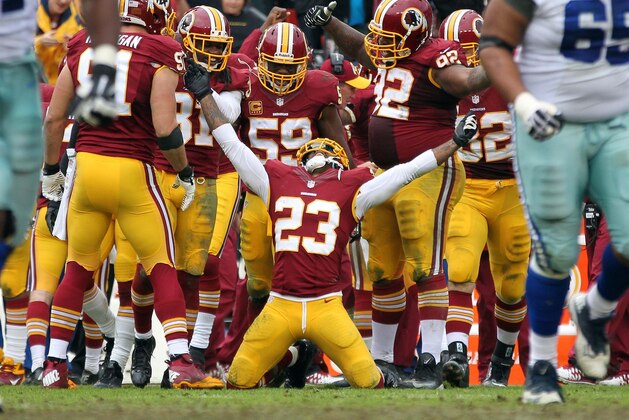 Dec 22, 2013; Landover, MD, USA; Washington Redskins cornerback DeAngelo Hall (23) celebrates after an interception against the Dallas Cowboys in the third quarter  at FedEx Field. The Cowboys won 24-23. Mandatory Credit: Geoff Burke-USA TODAY Sports