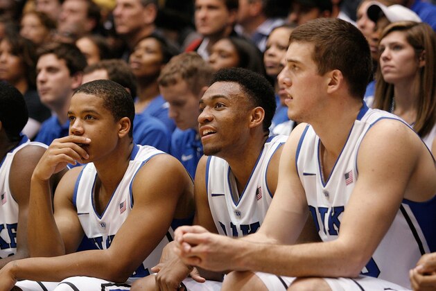 Dec 3, 2013; Durham, NC, USA; Duke Blue Devils guard Andre Dawkins (34) and forward Jabari Parker (1) and center Marshall Plumlee (40) on the bench late in their game against the Michigan Wolverines at Cameron Indoor Stadium. Mandatory Credit: Mark Dolejs-USA TODAY Sports