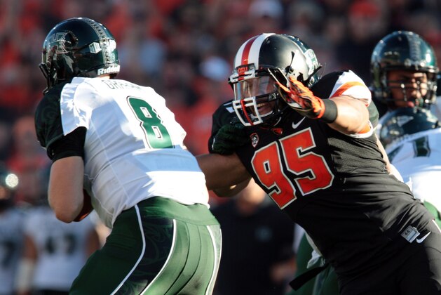 Sep 7, 2013; Corvallis, OR, USA; Oregon State Beavers defensive end Scott Crichton (95) pressures Hawaii Warriors quarterback Taylor Graham (8) at Reser Stadium. Mandatory Credit: Scott Olmos-USA TODAY Sports