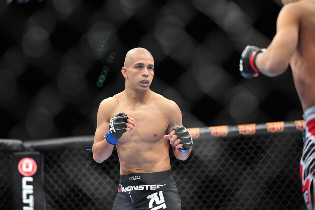 Dec 29, 2012; Las Vegas, NV, USA; John Moraga (left) and Chris Cariaso (right) during UFC 155 at the MGM Grand Garden Arena. Mandatory Credit: Gary A. Vasquez-USA TODAY Sports