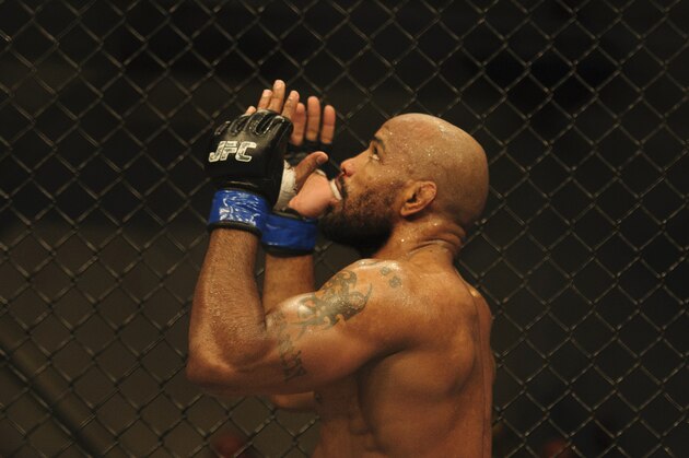 Nov 6, 2013; Fort Campbell, KY, USA; Yoel Romero (blue gloves) reacts to his win against Rony Markes (red gloves) in the middleweight bout during UFC Fight for the Troops at Fort Campbell. Mandatory Credit: Joshua Lindsey-USA TODAY Sports