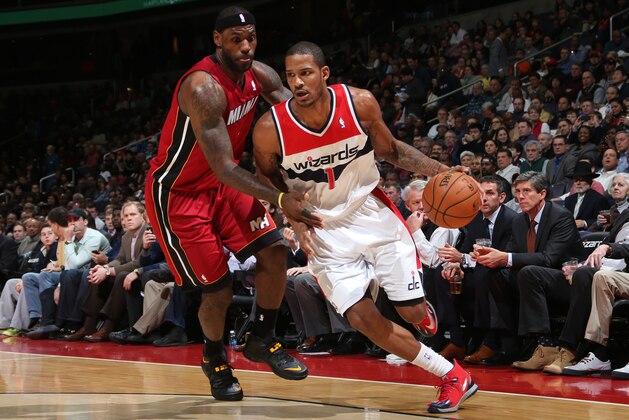 WASHINGTON, DC - JANUARY 15: Trevor Ariza #1 of the Washington Wizards drives against LeBron James #6 of the Miami Heat during the game at the Verizon Center on January 15, 2014 in Washington, DC. NOTE TO USER: User expressly acknowledges and agrees that, by downloading and or using this photograph, User is consenting to the terms and conditions of the Getty Images License Agreement. Mandatory Copyright Notice: Copyright 2014 NBAE (Photo by Ned Dishman/NBAE via Getty Images)