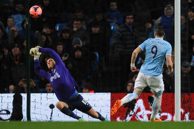 MANCHESTER, ENGLAND - JANUARY 15:  Alvaro Negredo of Manchester City scores the second goal past Simon Eastwood of Blackburn Rovers during the Budweiser FA Cup Third Round Replay match between Manchester City and Blackburn Rovers at the Etihad Stadium on January 15, 2014 in Manchester, England.  (Photo by Stu Forster/Getty Images)