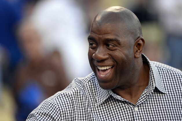October 15, 2013; Los Angeles, CA, USA;  Los Angeles Dodgers part owner Magic Johnson in attendance before the Dodgers play against the St. Louis Cardinals in game four of the National League Championship Series baseball game at Dodger Stadium. Mandatory Credit: Richard Mackson-USA TODAY Sports