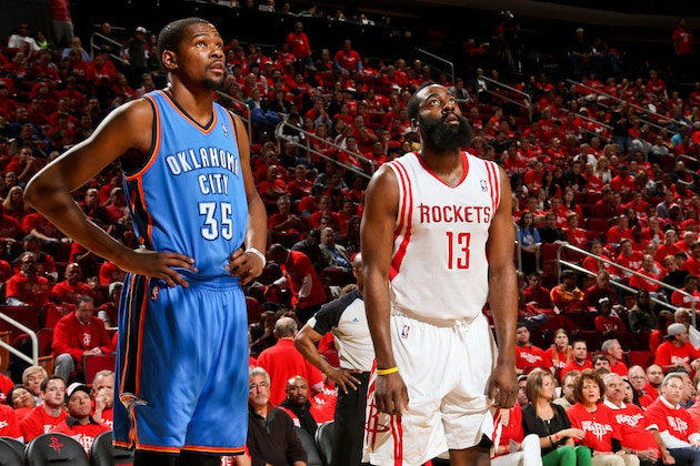 HOUSTON, TX - MAY 3: Kevin Durant #35 of the Oklahoma City Thunder and James Harden #13 of the Houston Rockets wait to resume play in Game Six of the Western Conference Quarterfinals during the 2013 NBA Playoffs on May 3, 2013 at the Toyota Center in Houston, Texas. NOTE TO USER: User expressly acknowledges and agrees that, by downloading and or using this photograph, User is consenting to the terms and conditions of the Getty Images License Agreement. Mandatory Copyright Notice: Copyright 2013 NBAE (Photo by Layne Murdoch/NBAE via Getty Images)