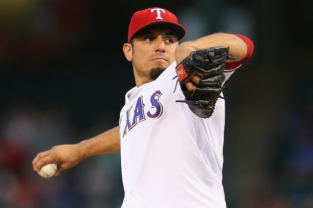 ARLINGTON, TX - SEPTEMBER 26:  Matt Garza #22 of the Texas Rangers throws against the Los Angeles Angels in the first inning at Rangers Ballpark in Arlington on September 26, 2013 in Arlington, Texas.  (Photo by Ronald Martinez/Getty Images)