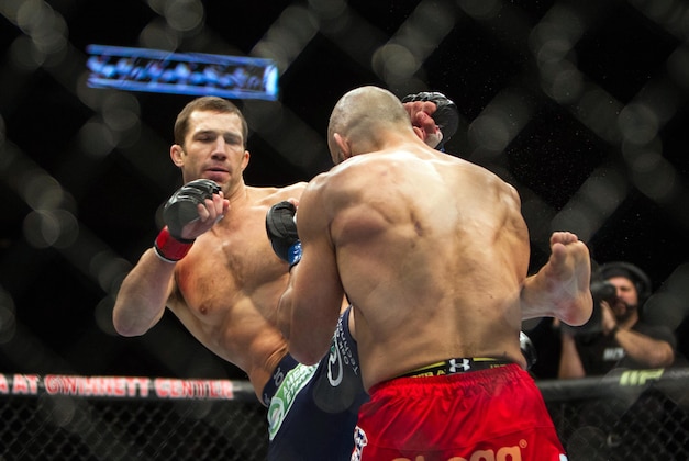 Jan 15, 2014; Duluth, GA, USA; Luke Rockhold (red gloves) fights Costas Philippou (blue gloves) during UFC Fight Night at Gwinnett Center. Rockhold wins. Mandatory Credit: Joshua S. Kelly-USA TODAY Sports