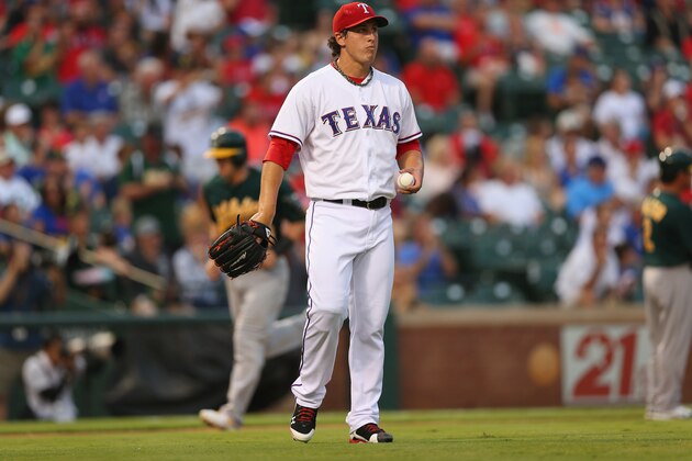 ARLINGTON, TX - SEPTEMBER 13: Derek Holland #45 of the Texas Rangers steps off the mound after giving up a three-run homerun against Yoenis Cespedes #52 of the Oakland Athletics in the first inning at Rangers Ballpark in Arlington on September 13, 2013 in Arlington, Texas. (Photo by Ronald Martinez/Getty Images) ARLINGTON, TX - SEPTEMBER 13: Derek Holland #45 of the Texas Rangers steps off the mound after giving up a three-run homerun against Yoenis Cespedes #52 of the Oakland Athletics in the first inning at Rangers Ballpark in Arlington on September 13, 2013 in Arlington, Texas. (Photo by Ronald Martinez/Getty Images)