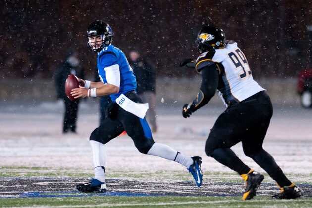 Dec 13, 2013; Charleston, IL, USA;  Towson Tigers defensive tackle Jon Desir (99) pursues Eastern Illinois Panthers quarterback Jimmy Garoppolo (10) during the fourth quarter at O'Brien Field. Mandatory Credit: Bradley Leeb-USA TODAY Sports