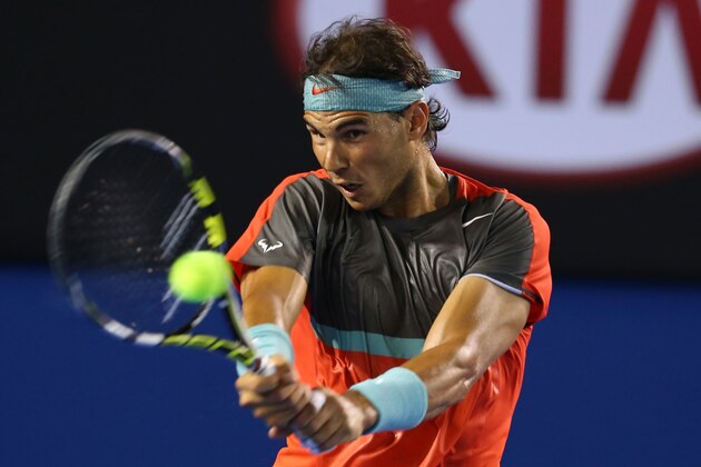MELBOURNE, AUSTRALIA - JANUARY 16:  Rafael Nadal of Spain plays a backhand in his second round match against Thanasi Kokkinakis of Australia during day four of the 2014 Australian Open at Melbourne Park on January 16, 2014 in Melbourne, Australia.  (Photo by Mark Kolbe/Getty Images)