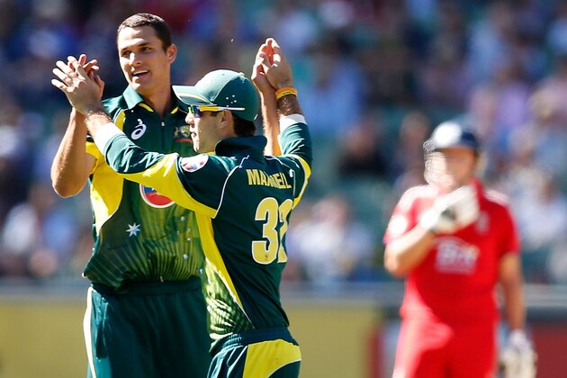 MELBOURNE, AUSTRALIA - JANUARY 12:  Nathan Coulter-Nile and Glenn Maxwell of Australia celebrate the wicket of Ravi Bopara of England during game one of the one day international series between Australia and England at Melbourne Cricket Ground on January 12, 2014 in Melbourne, Australia.  (Photo by Darrian Traynor/Getty Images)