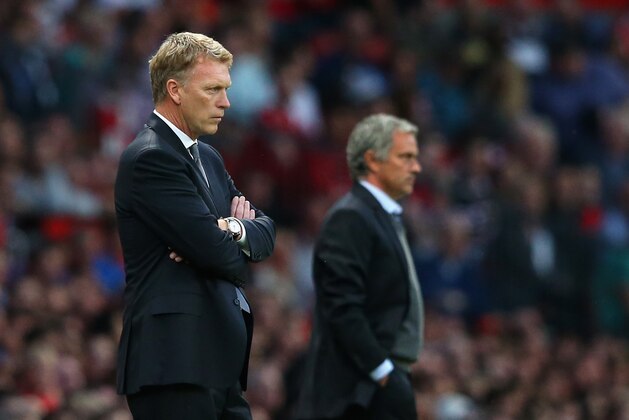 MANCHESTER, ENGLAND - AUGUST 26:  Manchester United Manager David Moyes and Chelsea Manager Jose Mourinho ((R) look on during the Barclays Premier League match between Manchester United and Chelsea at Old Trafford on August 26, 2013 in Manchester, England.  (Photo by Alex Livesey/Getty Images)