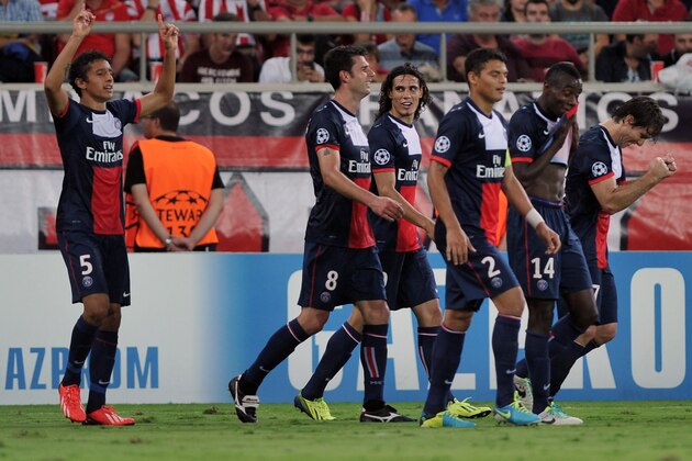 ATHENS, GREECE - SEPTEMBER 17:  Marquinhos (L) of Paris Saint-Germain FC celebrates his goal with team-mates during the UEFA Champions League group stage match between Olympiacos FC and Paris Saint-Germain FC held on September 17, 2013 at the Georgios Karaiskakis Stadium in Athens, Greece. (Photo by Milos Bicanski/EuroFootball/Getty Images)