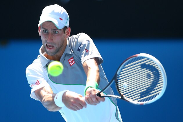 MELBOURNE, AUSTRALIA - JANUARY 15:  Novak Djokovic of Serbia plays a backhand in his second round match against Leonardo Mayer of Argentina during day three of the 2014 Australian Open at Melbourne Park on January 15, 2014 in Melbourne, Australia.  (Photo by Chris Hyde/Getty Images)