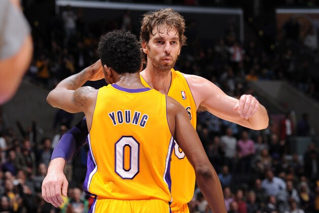 LOS ANGELES, CA - NOVEMBER 22: Pau Gasol #16 and Nick Young #0 of the Los Angeles Lakers embrace during a game against the Golden State Warriors on November 22, 2013 at STAPLES Center in Los Angeles, California. NOTE TO USER: User expressly acknowledges and agrees that, by downloading and/or using this Photograph, user is consenting to the terms and conditions of the Getty Images License Agreement. Mandatory Copyright Notice: Copyright 2013 NBAE (Photo by Andrew D. Bernstein/NBAE via Getty Images)