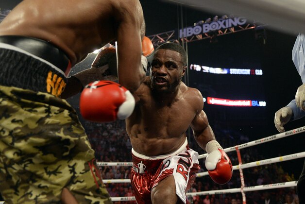 Sep 28, 2013; Montreal, Quebec, Canada;  Jean Pascal (red trunks) and George Blades (camouflage trunks) box during their light-heavyweight bout at the Bell Centre. Mandatory Credit: Eric Bolte-USA TODAY Sports