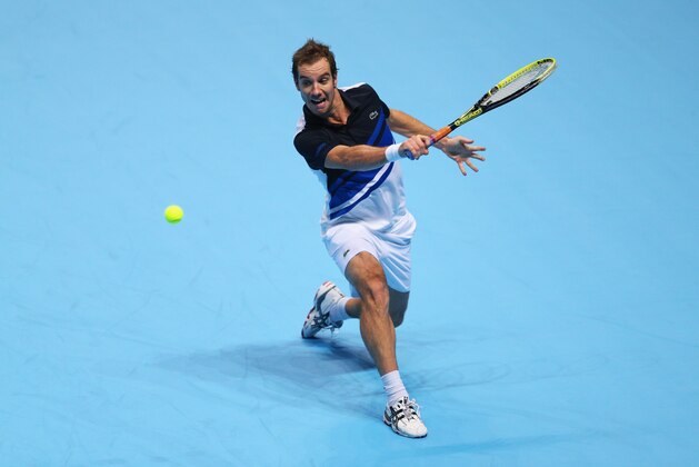 LONDON, ENGLAND - NOVEMBER 07:  Richard Gasquet of France hits a backhand during his men's singles match against Roger Federer of Switzerland  during day four of the Barclays ATP World Tour Finals at O2 Arena on November 7, 2013 in London, England.  (Photo by Clive Brunskill/Getty Images)