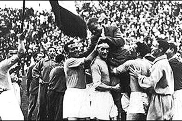Italy manager Vittorio Pozzo is carried from the field in triumph by his players after winning the 1934 World Cup final.