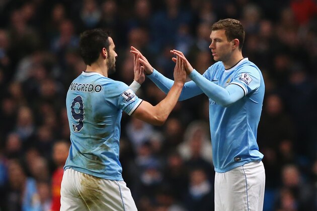 MANCHESTER, ENGLAND - DECEMBER 26:  Alvaro Negredo of Manchester City is substituted for Edin Dzeko during the Barclays Premier League match between Manchester City and Liverpool at Etihad Stadium on December 26, 2013 in Manchester, England.  (Photo by Alex Livesey/Getty Images)