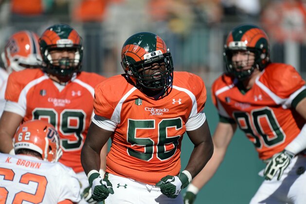 Sep 28, 2013; Fort Collins, CO, USA; Colorado State Rams linebacker Shaquil Barrett (56) reacts after causing a fumble for a safety late in the third quarter against the UTEP Miners at Hughes Stadium. Mandatory Credit: Ron Chenoy-USA TODAY Sports