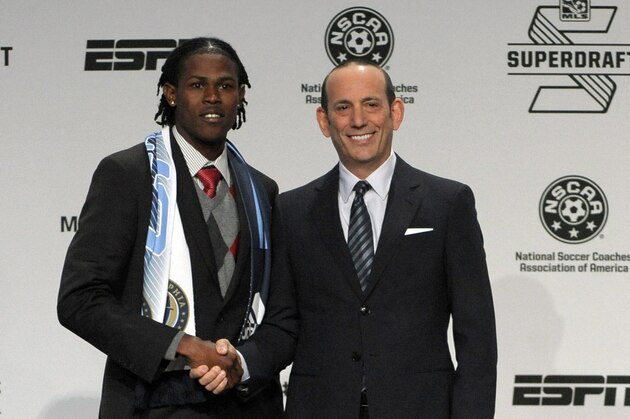 Jan 16, 2014; Philadelphia, PA, USA; Andre Blake (Connecticut) poses for a photo with MLS commissioner Don Garber after being selected as the number one overall pick in the first round to the Philadelphia Union in the 2014 MLS Superdraft at Philadelphia Convention Center. Mandatory Credit: Eric Hartline-USA TODAY Sports