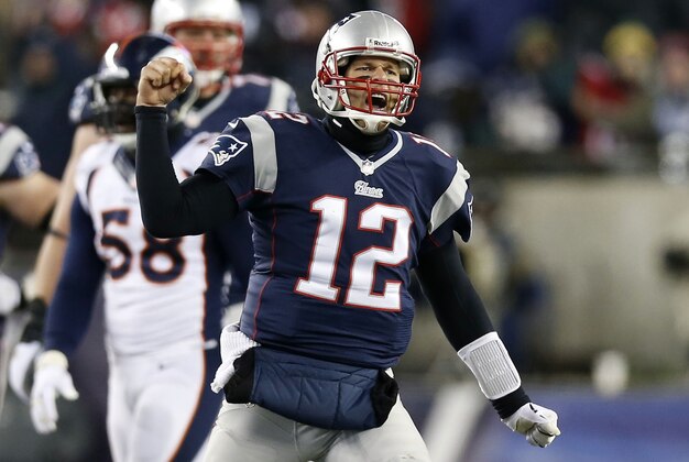 Nov 24, 2013; Foxborough, MA, USA; New England Patriots quarterback Tom Brady (12) reacts after a completed pass against the Denver Broncos during overtime at Gillette Stadium Stadium. Mandatory Credit: Greg M. Cooper-USA TODAY Sports
