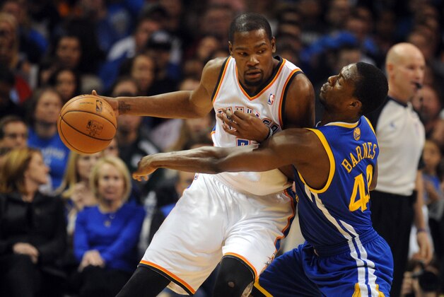 Nov 29, 2013; Oklahoma City, OK, USA;  Oklahoma City Thunder small forward Kevin Durant (35) handles the ball against Golden State Warriors small forward Harrison Barnes (40) during the second quarter at Chesapeake Energy Arena. Mandatory Credit: Mark D. Smith-USA TODAY Sports