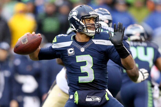SEATTLE, WA - JANUARY 11:  Quarterback Russell Wilson #3 of the Seattle Seahawks looks to pass the ball against the New Orleans Saints in the second quarter during the NFC Divisional Playoff Game at CenturyLink Field on January 11, 2014 in Seattle, Washington.  (Photo by Jeff Gross/Getty Images)