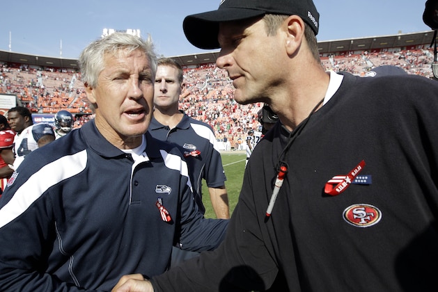 Seattle Seahawks coach Pete Carroll, left, shakes hands with San Francisco 49ers coach Jim Harbaugh after an NFL football game in San Francisco, Sunday, Sept. 11, 2011. The 49ers won 33-17. (AP Photo/Paul Sakuma)