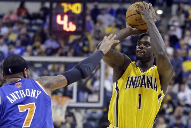 Indiana Pacers guard Lance Stephenson shoots over New York Knicks forward Carmelo Anthony during the second half of an NBA basketball game in Indianapolis, Thursday, Jan. 16, 2014. The Pacers defeated the Knicks 117-89. (AP Photo/Michael Conroy)