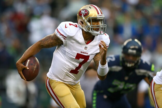 SEATTLE - SEPTEMBER 15:  Quarterback Colin Kaepernick #7 of the San Francisco 49ers runs the ball against the Seattle Seahawks on September 15, 2013 at Century Link Field in Seattle, Washington.  (Photo by Jonathan Ferrey/Getty Images)