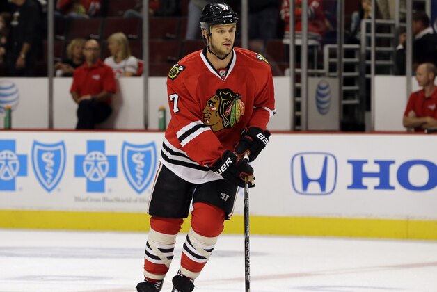 Chicago Blackhawks' Brent Seabrook (7) works with teammates before an NHL hockey game against the Washington Capitals in Chicago, Tuesday, Oct .1, 2013. (AP Photo/Nam Y. Huh)