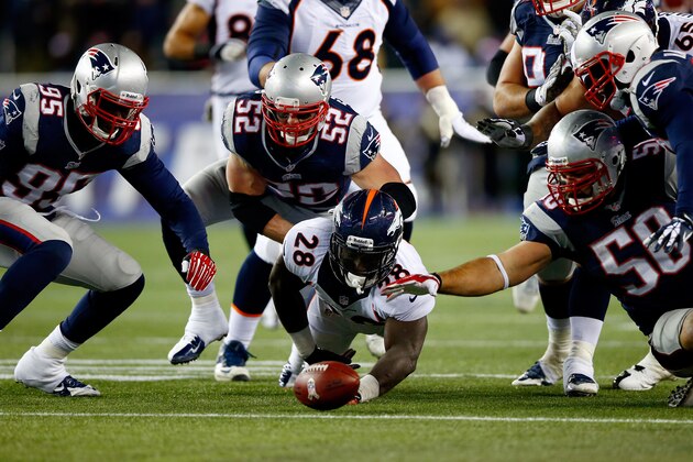 FOXBORO, MA - NOVEMBER 24:  Running back Montee Ball #28 of the Denver Broncos fumbles the ball in the third quarter against the New England Patriots during a game at Gillette Stadium on November 24, 2013 in Foxboro, Massachusetts.  (Photo by Jared Wickerham/Getty Images)