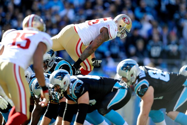 CHARLOTTE, NC - JANUARY 12: Ahmad Brooks #55 of the San Francisco 49ers jumps over the offensive line of the Carolina Panthers in the second quarter during the NFC Divisional Playoff Game at Bank of America Stadium on January 12, 2014 in Charlotte, North Carolina.  (Photo by Grant Halverson/Getty Images)