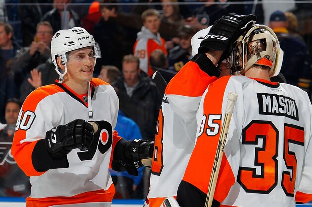 BUFFALO, NY - JANUARY 14:  Vincent Lecavalier #40 of the Philadelphia Flyers heads toward goaltender Steve Mason #35 to celebrate their 4-3 victory over the Buffalo Sabres on January 14, 2014 at the First Niagara Center in Buffalo, New York.  (Photo by Bill Wippert/NHLI via Getty Images)