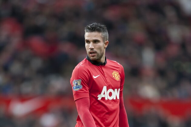 Manchester United's Robin van Persie during his team's English Premier League soccer match against Newcastle at Old Trafford Stadium, Manchester, England, Wednesday Dec. 7, 2013. (AP Photo/Jon Super)