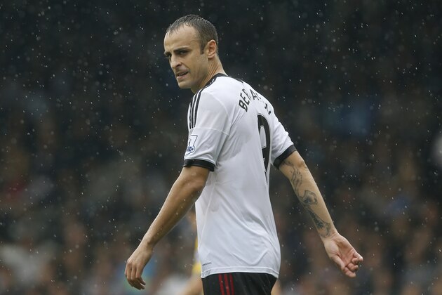 Fulham's Dimitar Berbatov plays against Arsenal during their English Premier League soccer match at Craven Cottage, London, Saturday, Aug. 24, 2013. (AP Photo/Sang Tan)