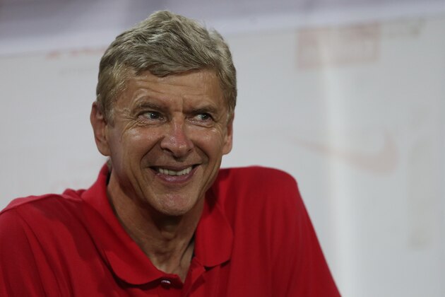 HANOI, VIETNAM - JULY 17:  Arsenal Manager Arsene Wenger watches on ahead of the start of the international friendly match between Vietnam and Arsenal FC at My Dinh National Stadium on July 17, 2013 in Hanoi, Vietnam.  (Photo by Chris McGrath/Getty Images)