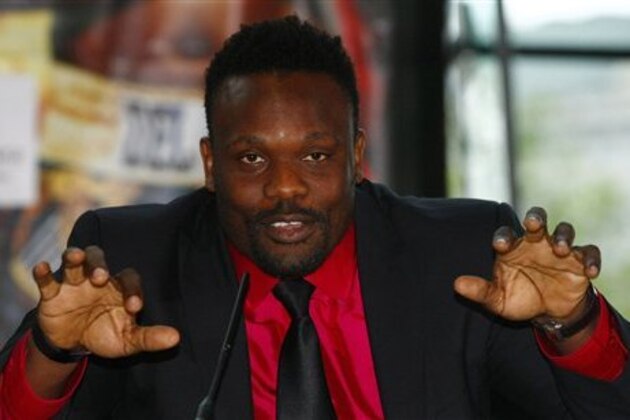 British boxer Dereck Chisora talks to the media during a news conference, in London, Tuesday, June 12, 2012. Dereck Chisora will face David Haye in a bout on July 14, 2012. (AP Photo/Tim Hales)