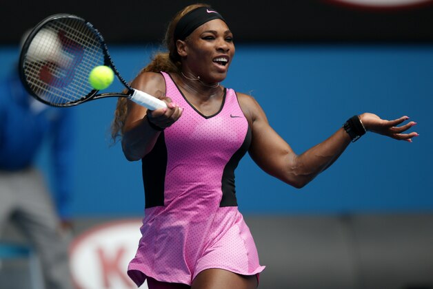 Serena Williams of the United States makes a forehand return to Vesna Dolonc of Serbia during their second round match at the Australian Open tennis championship in Melbourne, Australia, Wednesday, Jan. 15, 2014.(AP Photo/Aaron Favila)