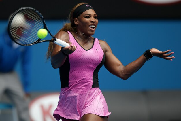 Serena Williams of the United States makes a forehand return to Vesna Dolonc of Serbia during their second round match at the Australian Open tennis championship in Melbourne, Australia, Wednesday, Jan. 15, 2014.(AP Photo/Aaron Favila)