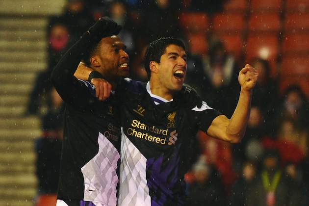 STOKE ON TRENT, ENGLAND - JANUARY 12:  Luis Suarez of Liverpool celebrates with Daniel Sturridge (L) as he scores their fourth goal during the Barclays Premier League match between Stoke City and Liverpool at Britannia Stadium on January 12, 2014 in Stoke on Trent, England.  (Photo by Laurence Griffiths/Getty Images)