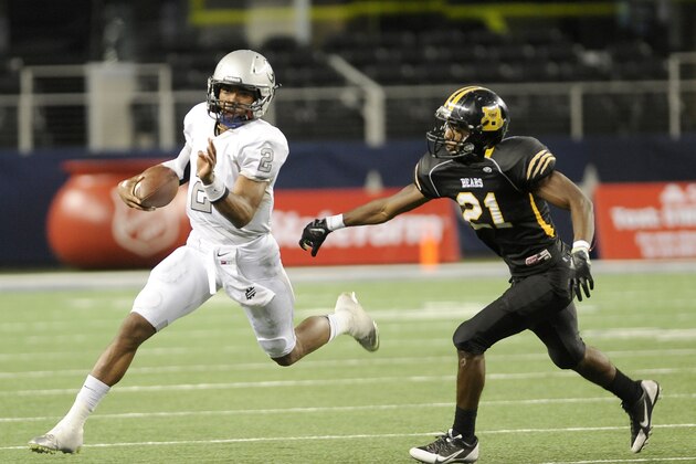 Denton Guyer quarterback Jerrod Heard (2) runs upfield past Northside Brennan's Llandre Mitchell (21) during the first half of the UIL Class 4A, Division I high school football championship game, Friday, Dec. 20, 2013, in Arlington, Texas. (AP Photo/Matt Strasen) Denton Guyer quarterback Jerrod Heard (2) runs upfield past Northside Brennan's Llandre Mitchell (21) during the first half of the UIL Class 4A, Division I high school football championship game, Friday, Dec. 20, 2013, in Arlington, Texas. (AP Photo/Matt Strasen)