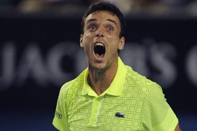 Roberto Bautista Agut of Spain celebrates after winning his second round match against Juan Martin del Potro of Argentina at the Australian Open tennis championship in Melbourne, Australia, Thursday, Jan. 16, 2014. (AP Photo/Andrew Brownbill)