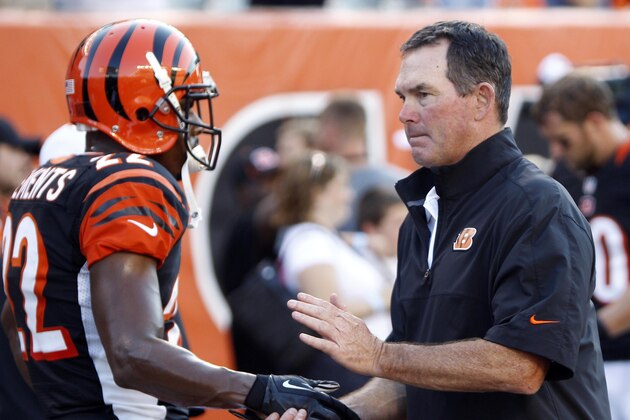 Aug 23, 2012; Cincinnati, OH, USA; Cincinnati Bengals defensive back Nate Clements (22) and offensive coordinator Mike Zimmer shake hands before the game against the Green Bay Packers at Paul Brown Stadium. Mandatory Credit: Frank Victores-USA TODAY Sports