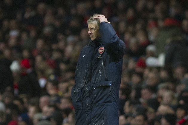 Arsenal's manager Arsene Wenger, looks on during their English Premier League match against Cardiff City, at Emirates Stadium, in London, Wednesday, Jan. 1, 2014. (AP Photo/Bogdan Maran)