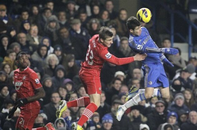 Chelsea's Oscar, right, competes with Southampton's Luke Shaw during their English Premier League soccer match at Stamford Bridge, London, Wednesday, Jan. 16, 2013. (AP Photo/Sang Tan)