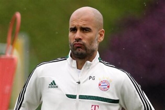 Bayern Munich's head coach Pep Guardiola looks at players during a training session at the ASPIRE Academy for Sports Excellence in Doha, Qatar, Monday, Jan. 6, 2013. (AP Photo/Osama Faisal)