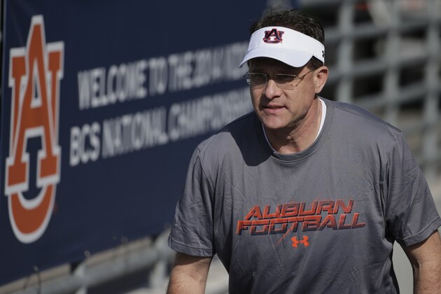 Auburn coach Gus Malzahn arrives for NCAA college football practice on Friday, Jan. 3, 2014, in Irvine, Calif. Auburn is scheduled to play Florida State on Monday in the BCS national championship game. (AP Photo/Chris Carlson)